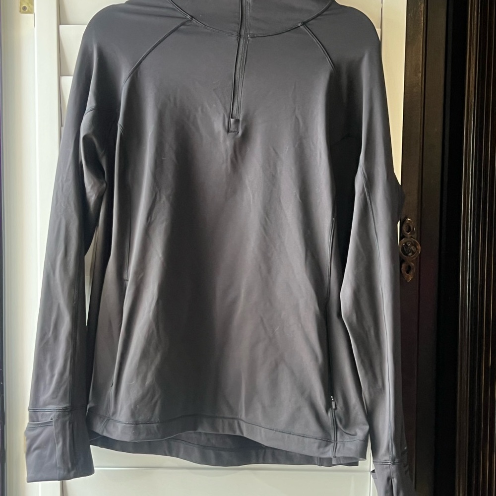 Athleta 1/4 Zip with zippered pockets and thumb holes